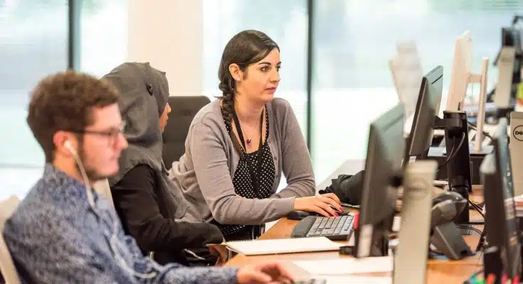 unknown persons using computer indoors