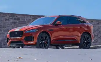 orange bmw m 3 coupe on gray concrete road during daytime